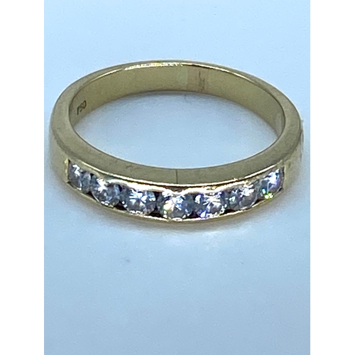 183 - An 18ct yellow gold diamond eternity ring, 4.9 grams approx, size P, set with 7 round brilliant cut ... 