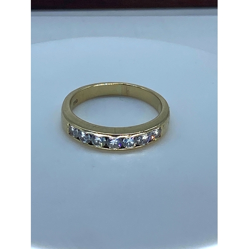 183 - An 18ct yellow gold diamond eternity ring, 4.9 grams approx, size P, set with 7 round brilliant cut ... 