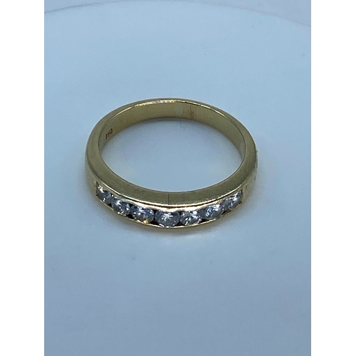 183 - An 18ct yellow gold diamond eternity ring, 4.9 grams approx, size P, set with 7 round brilliant cut ... 