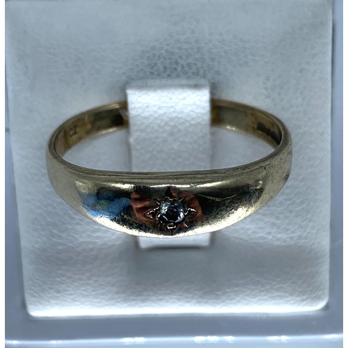 188 - A 9ct yellow gypsy ring, set with an unprecious stone, size U, 2.5 grams in weight approx