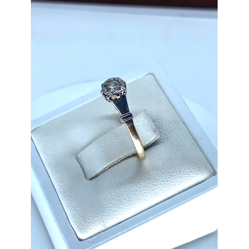 190 - A 9ct yellow gold & platinum diamond solitaire ring, size M, 1.3 grams in weight approx