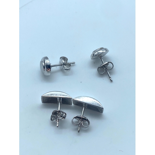 23 - 2x pairs of 9ct white gold stud earrings, 1.7 grams total approx weight, both pairs are in lovely co... 