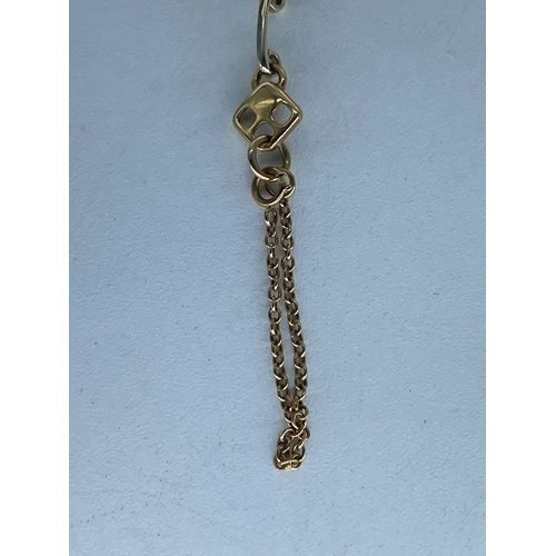 28 - A 9ct yellow & white gold link bracelet, comes with a safety chain, approx weight is 7 grams, 7 1/2 ... 