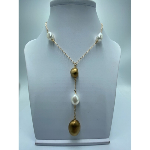 3 - A 14ct yellow gold seed pearl & gold pearl drop necklace, necklace has 3 extenders, pearl on the las... 