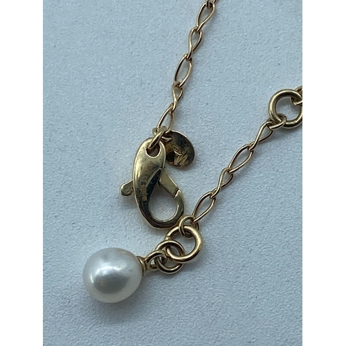 3 - A 14ct yellow gold seed pearl & gold pearl drop necklace, necklace has 3 extenders, pearl on the las... 