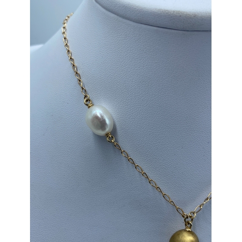 3 - A 14ct yellow gold seed pearl & gold pearl drop necklace, necklace has 3 extenders, pearl on the las... 