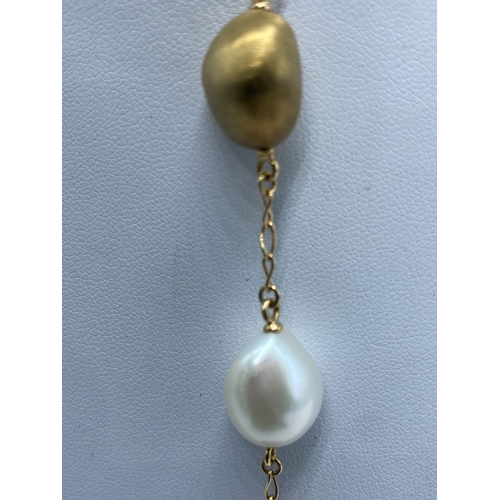 3 - A 14ct yellow gold seed pearl & gold pearl drop necklace, necklace has 3 extenders, pearl on the las... 