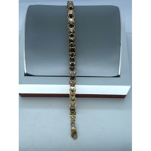 30 - A 9ct yellow & white gold heavy link design bracelet, 7 3/4 inches long approx, weight is 18.6 grams... 