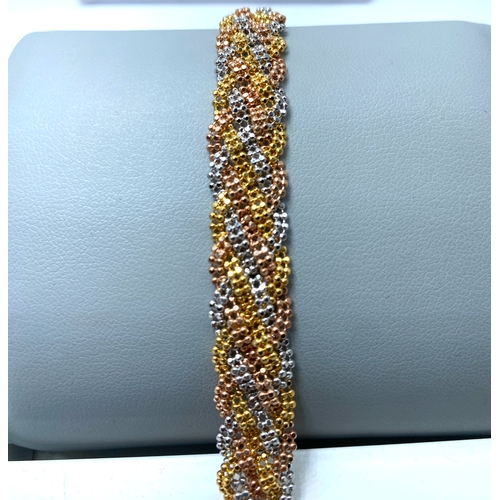 5 - An 18ct tri-colour woven designer bracelet, 20 grams in weight approx, fully hallmarked, 7 inches lo... 