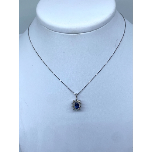 54 - An 18ct white gold diamond & sapphire pendant & chain, chain is 18 inches long approx, pendant is 17... 