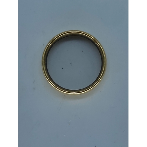 56 - A large 18ct yellow gold wedding band, 7.4 grams in weight approx, 4.5mm wide, size R, fully hallmar... 