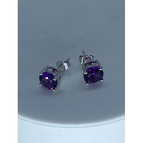 58 - A paid of 18ct white gold amethyst stud earrings, amethysts are 7mm, beautifully cut amethyst stones... 