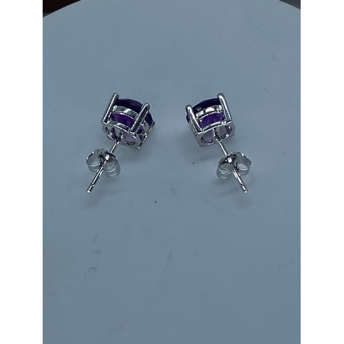 58 - A paid of 18ct white gold amethyst stud earrings, amethysts are 7mm, beautifully cut amethyst stones... 