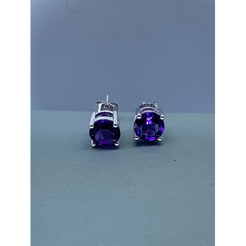 58 - A paid of 18ct white gold amethyst stud earrings, amethysts are 7mm, beautifully cut amethyst stones... 