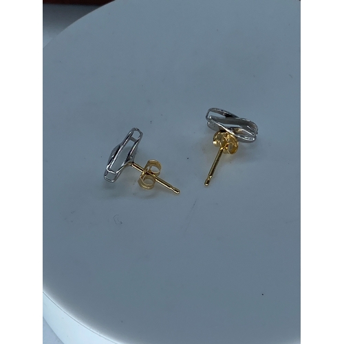 59 - A pair of 18ct white & yellow gold knot design earrings,  weight is 1.3 grams approx