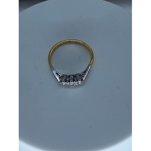 60 - An 18ct yellow gold & platinum 3 stone diamond ring, 2.2 grams in weight approx, size O,