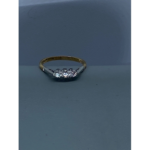 60 - An 18ct yellow gold & platinum 3 stone diamond ring, 2.2 grams in weight approx, size O,