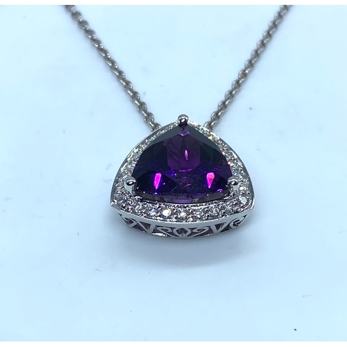 62 - An 18ct white gold large amethyst & diamond pendant & chain, amethyst is a triangle cut stone measur... 