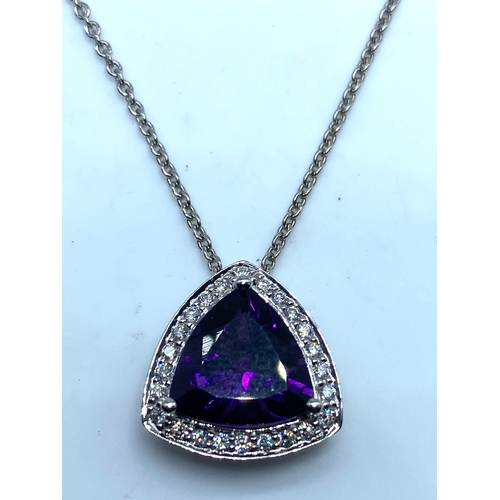 62 - An 18ct white gold large amethyst & diamond pendant & chain, amethyst is a triangle cut stone measur... 