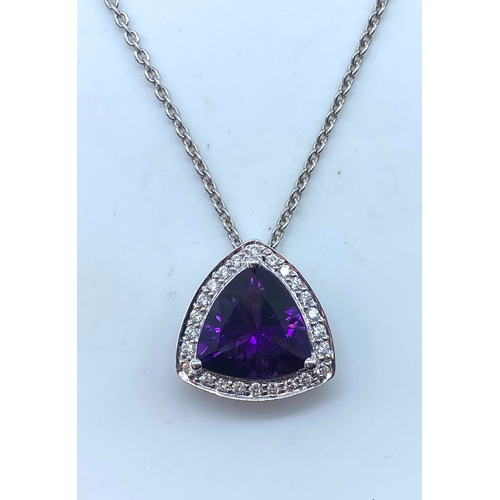 62 - An 18ct white gold large amethyst & diamond pendant & chain, amethyst is a triangle cut stone measur... 