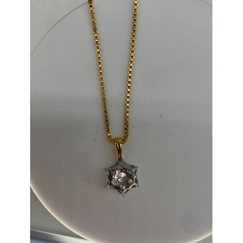 63 - An 18ct yellow & white gold daisy diamond pendant with chain, approx 0.75ct diamonds, pendant & chai... 