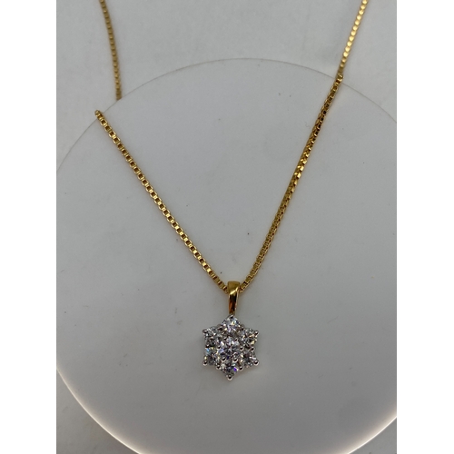 63 - An 18ct yellow & white gold daisy diamond pendant with chain, approx 0.75ct diamonds, pendant & chai... 