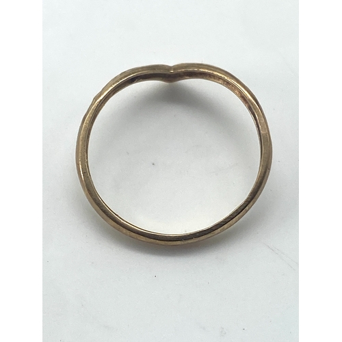 80 - A 9ct yellow gold wishbone ring, size R, 1.5 grams in weight approx