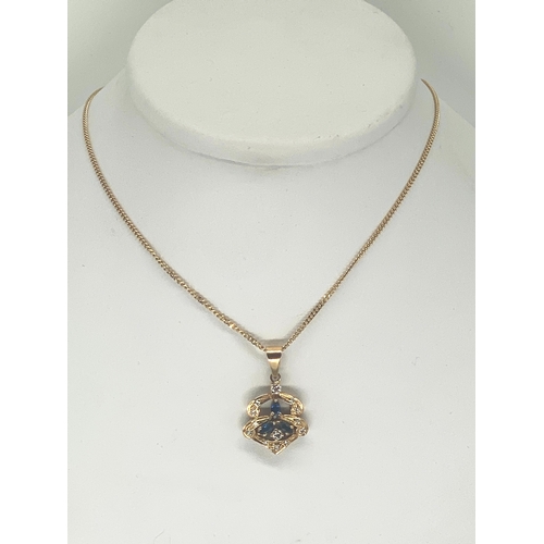 84 - An 18ct yellow gold sapphire & diamond pendant & chain, chain is 15 inches long, pendant is set with... 