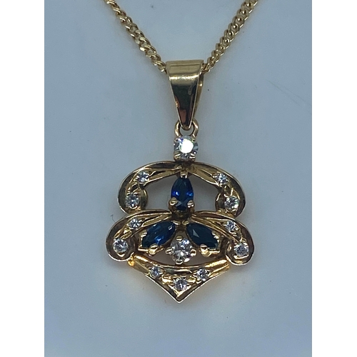 84 - An 18ct yellow gold sapphire & diamond pendant & chain, chain is 15 inches long, pendant is set with... 