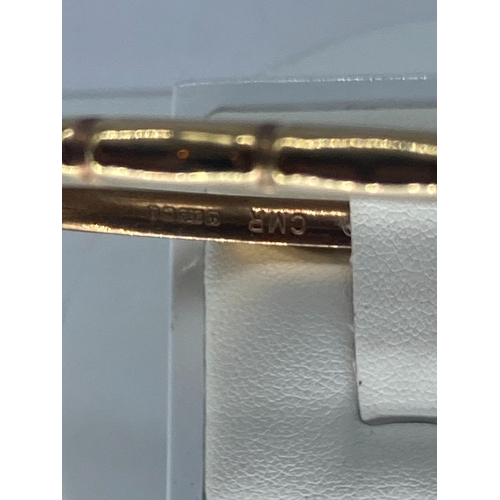 92 - A 9ct yellow gold bangle, 7.6 grams in weight approx, with a safety chain, no signs of damage, fully... 