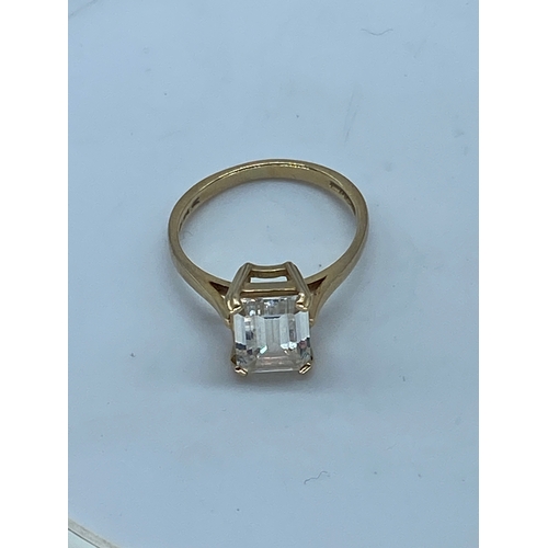 101 - A 14ct yellow gold emerald cut cz stone dress ring, cz stone is approx 2.5ct, weight is 3 grams appr... 