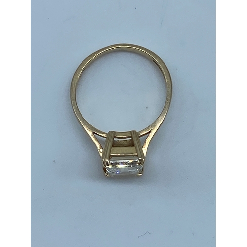 101 - A 14ct yellow gold emerald cut cz stone dress ring, cz stone is approx 2.5ct, weight is 3 grams appr... 