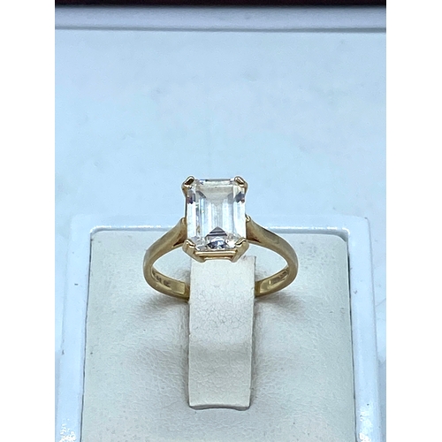 101 - A 14ct yellow gold emerald cut cz stone dress ring, cz stone is approx 2.5ct, weight is 3 grams appr... 