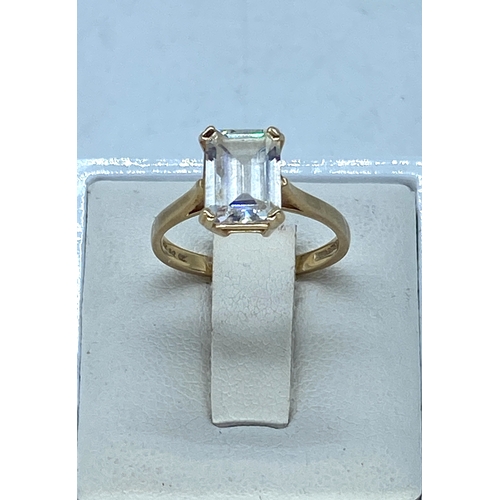 101 - A 14ct yellow gold emerald cut cz stone dress ring, cz stone is approx 2.5ct, weight is 3 grams appr... 