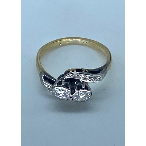 117 - An 18ct yellow gold & platinum 2 stone diamond twist ring, size J, weight is 2.9 grams approx, diamo... 