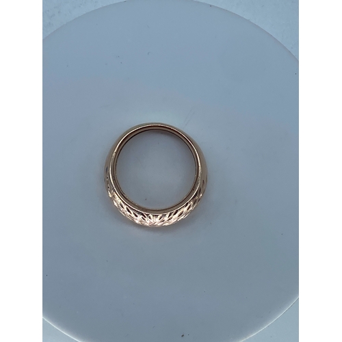 130 - A 9ct rose gold dress ring, diamond cut design, weight is 2.8 grams approx, size N,