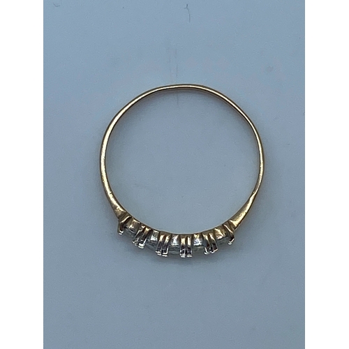 137 - A 9ct yellow gold 5 stone eternity band, stones are cz set, ring weighs 1.1 grams approx, size L 1/2