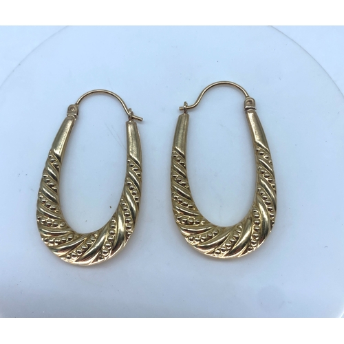 157 - A pair of 9ct yellow gold hoop earrings, 1.6 grams in weight approx, 32mm x 18mm