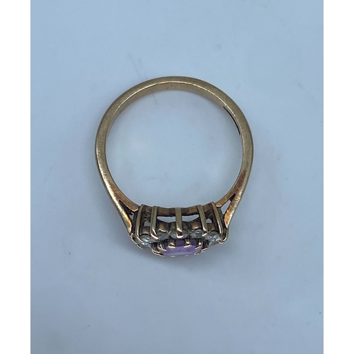 160 - A 9ct yellow gold amethyst dress ring, size N, weight is 3.4 grams approx, surrounding stones are cz