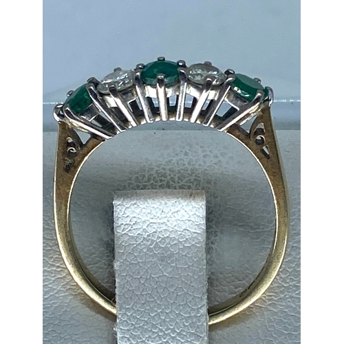 211 - An 18ct yellow gold emerald & diamond 5 stone eternity band, size O, 3 grams in weight approx