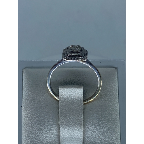 214 - An 18ct white gold halo diamond ring, size I, 1.6 grams in weight approx, will require a Rhodium pol... 