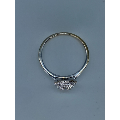 214 - An 18ct white gold halo diamond ring, size I, 1.6 grams in weight approx, will require a Rhodium pol... 