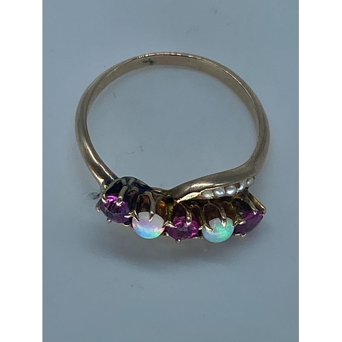 217 - A 15ct vintage yellow gold opal & ruby dress ring, unhallmarked but tested as 15ct, size P, weight i... 