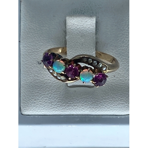 217 - A 15ct vintage yellow gold opal & ruby dress ring, unhallmarked but tested as 15ct, size P, weight i... 