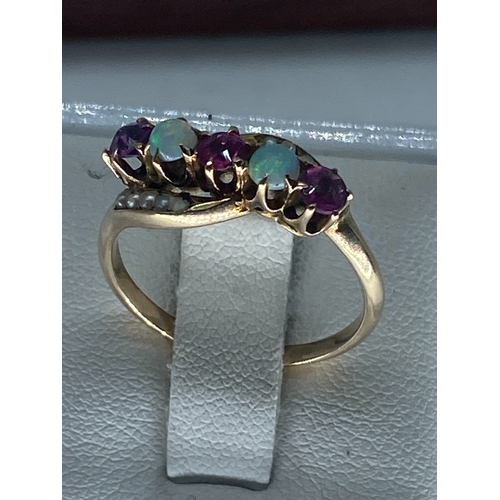 217 - A 15ct vintage yellow gold opal & ruby dress ring, unhallmarked but tested as 15ct, size P, weight i... 