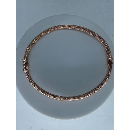 218 - A 9ct rose gold bangle, 4.2 grams in weight approx,