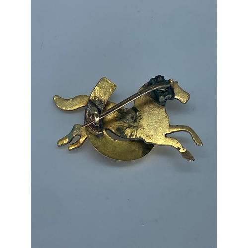 221 - A 9ct yellow gold & silver brooch, front is yellow gold and the back is testing as silver,