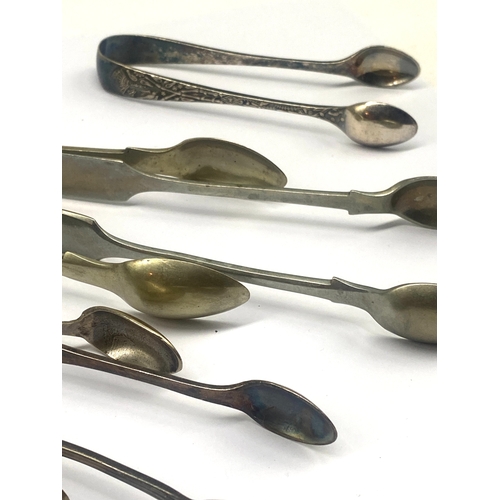 313 - A mixed lot of plated sugar tongs, mixed sizes also