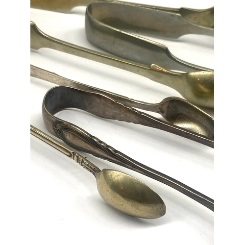 313 - A mixed lot of plated sugar tongs, mixed sizes also