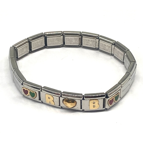 318 - A nomination bracelet & charms, 5x 18ct gold & enamel charms